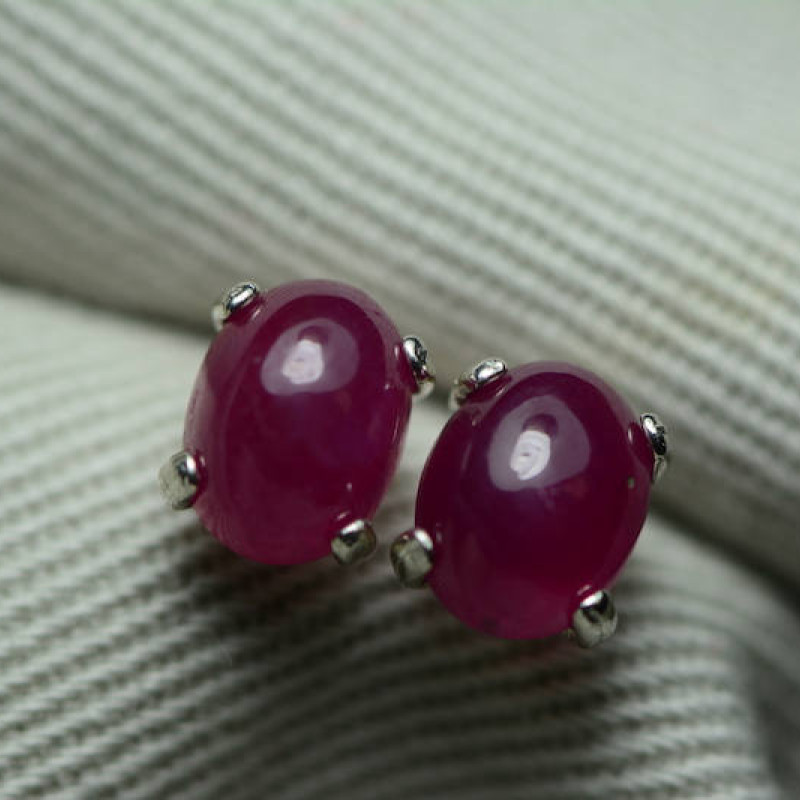 Sold at Auction: A PAIR OF RUBY AND DIAMOND DROP EARRINGS in platinum, each  earring set with a cabochon cut ruby s...