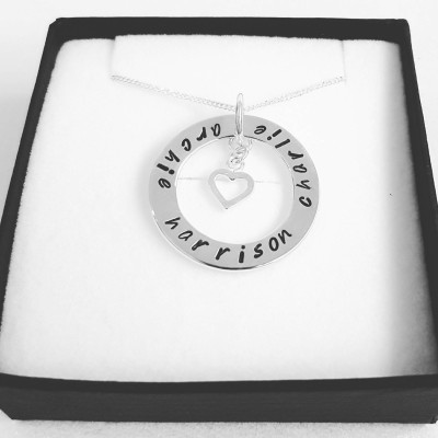 Large sterling silver ring pendant with family names and an open heart charm!