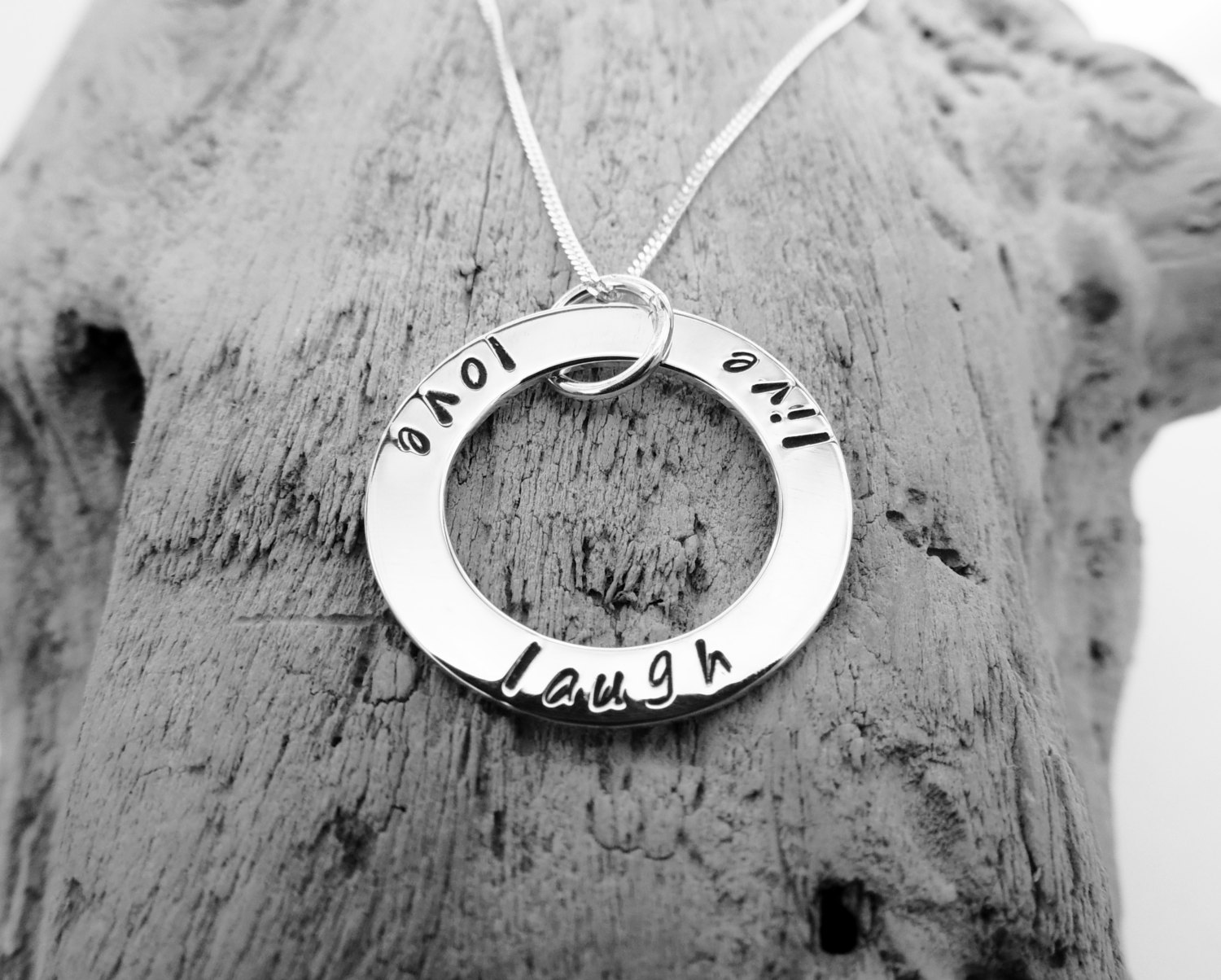 Sterling silver ring pendant with 'Live', 'Love', 'Laugh'.